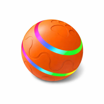 Interactieve LED speelbal voor honden en katten in oranje, met lichtgevende ringen en reliëfstructuur voor actief spelen.